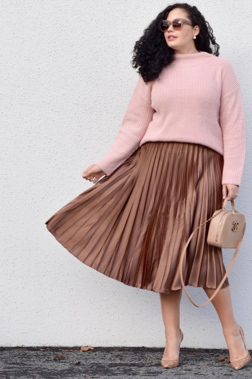 Girl With Curves blogger Tanesha Awasthi wears a Satin Skirt and high neck sweater.