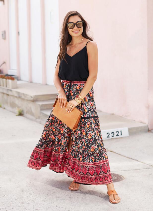 For a breezy outfit, pair a boho skirt with a simple cami like With Love From Kat.