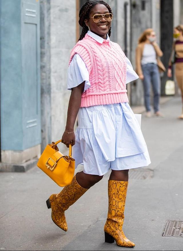 sweater vest over a dress